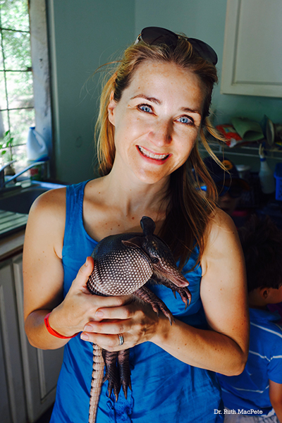 Dr. Ruth MacPete holding an armadillo