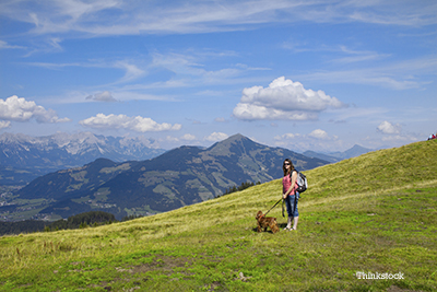 Woman hiking with her dog