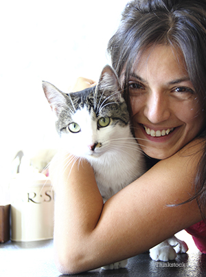 Woman hugging her cat