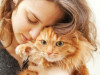 woman-hugs-thin-cat