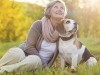 Woman with her dog during the fall season