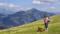 Woman hiking with dog