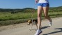 Girl jogging with her dog 