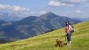 Woman hiking with dog