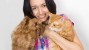 Woman holding a cat and a dog