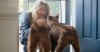 Woman greeting her dogs at the door